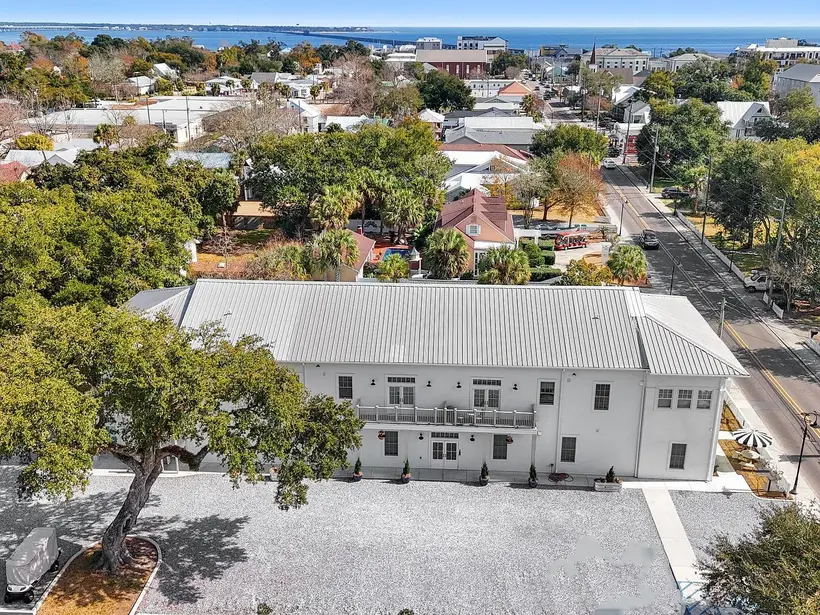 Aerial view over the 315A Main Street building, with the street running past Old Town rooftops toward the water
