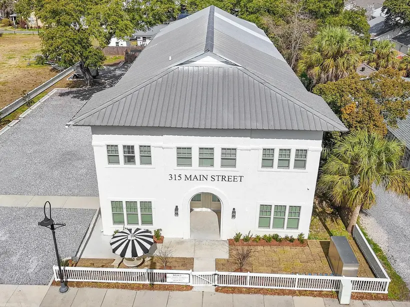 Aerial view of the 315A Main Street facade, metal roof and striped umbrella