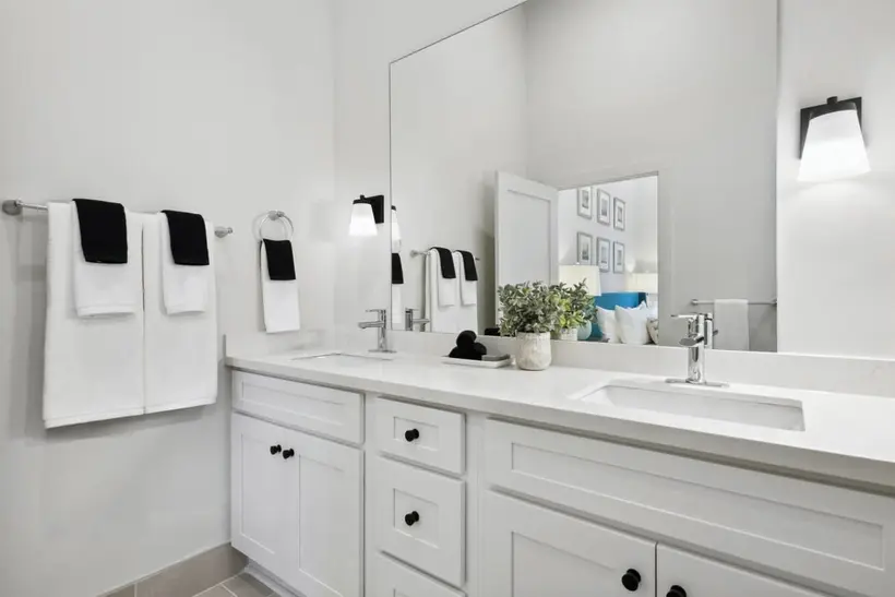 Double vanity with an oversized mirror