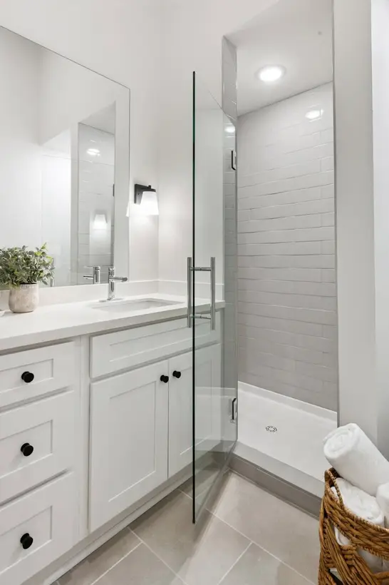 Walk-in accessible shower with tile surround in Bathroom 1