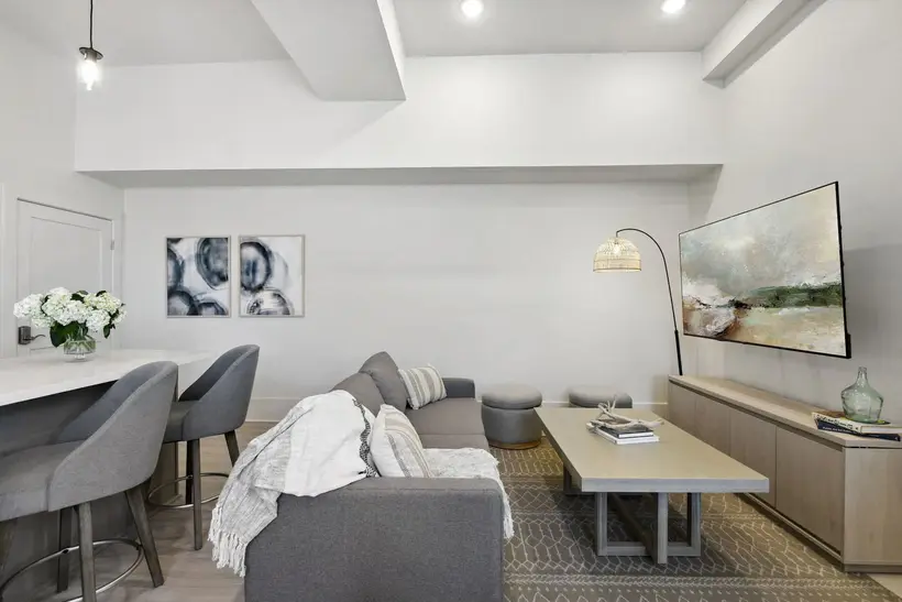 Living room with sofa, coffee table and a 70-inch TV